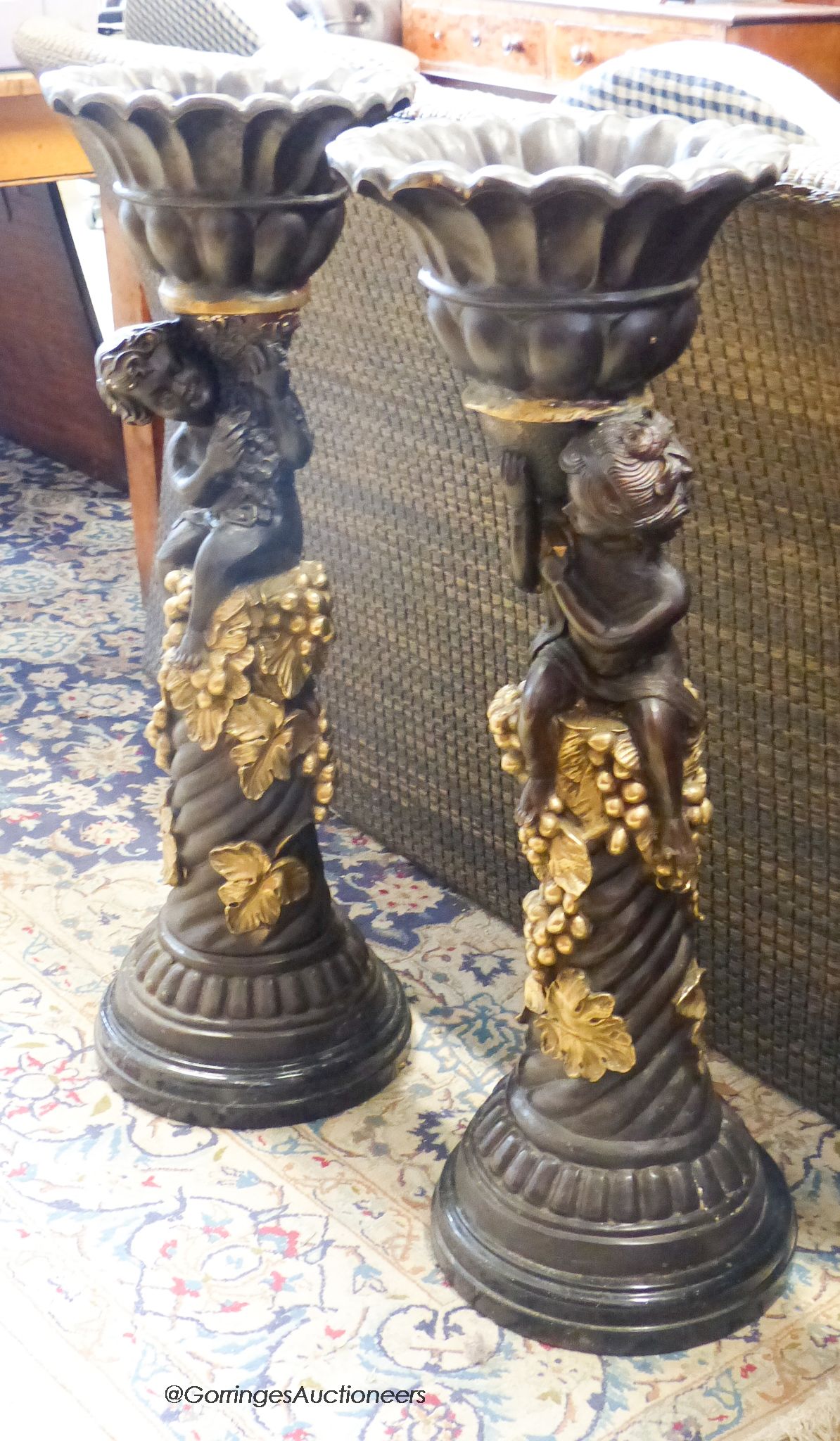 After Moreau. A pair of bronzed metal planters. H-86cm.